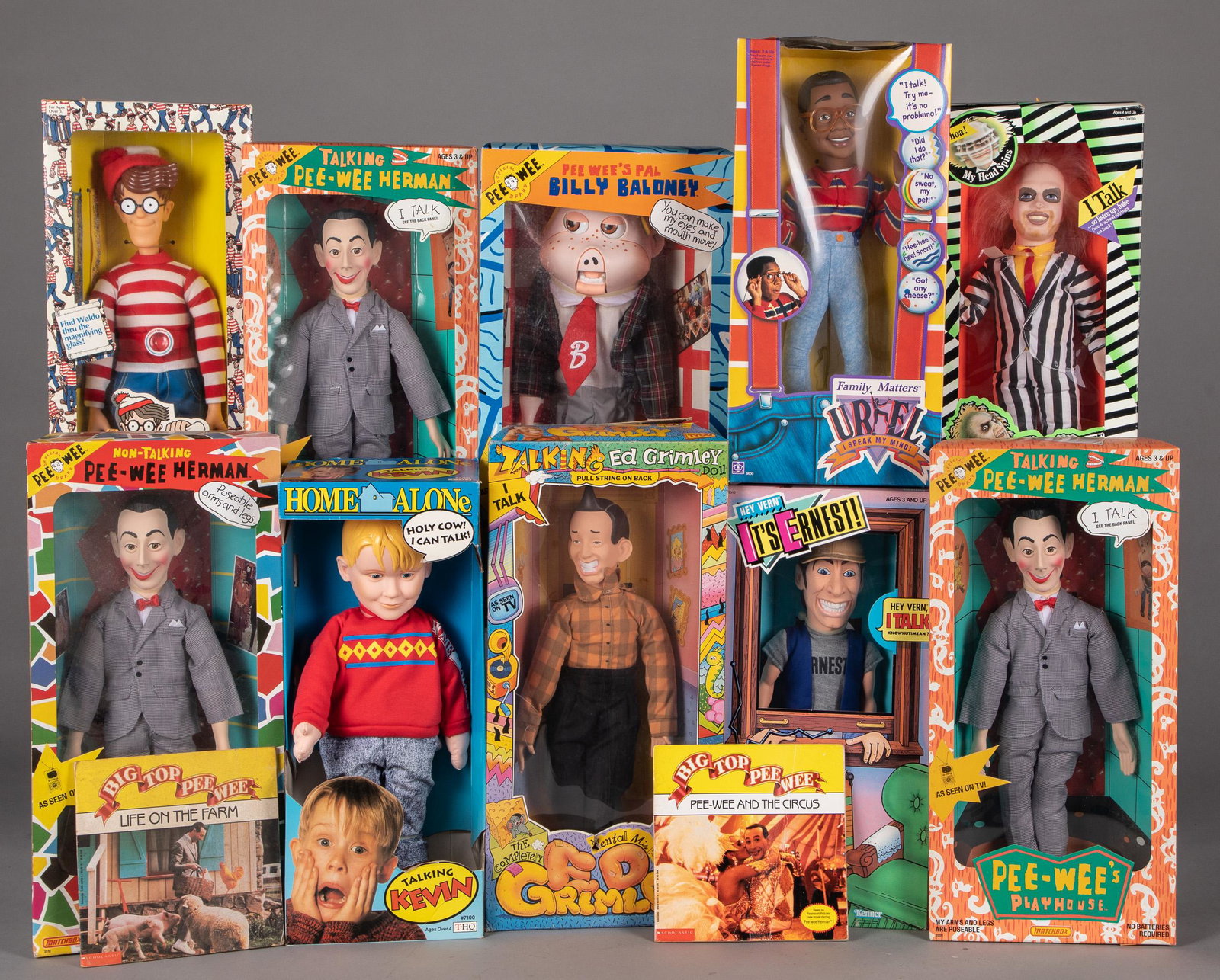 Ten TV personality and movie character dolls: Ten TV personality and movie character dolls, in original boxes, to include three Matchbox Pee-Wee Herman dolls, a Billy Baloney doll, 1991 THQ Home Alone Kevin, 1989 Kenner Beetlejuice, 1989 Tyco Ed