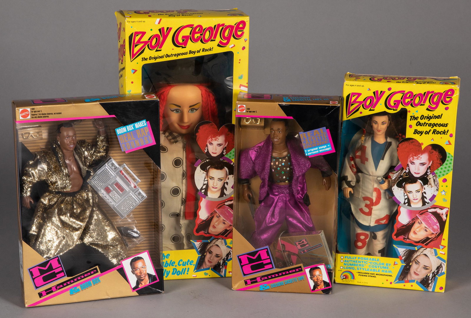 Two LJN 1984 Boy George dolls, etc.: Two LJN 1984 Boy George dolls, in the original boxes, 13'' h. and 11'' h., together with two Mattel 1991 MC Hammer dolls in the original boxes.