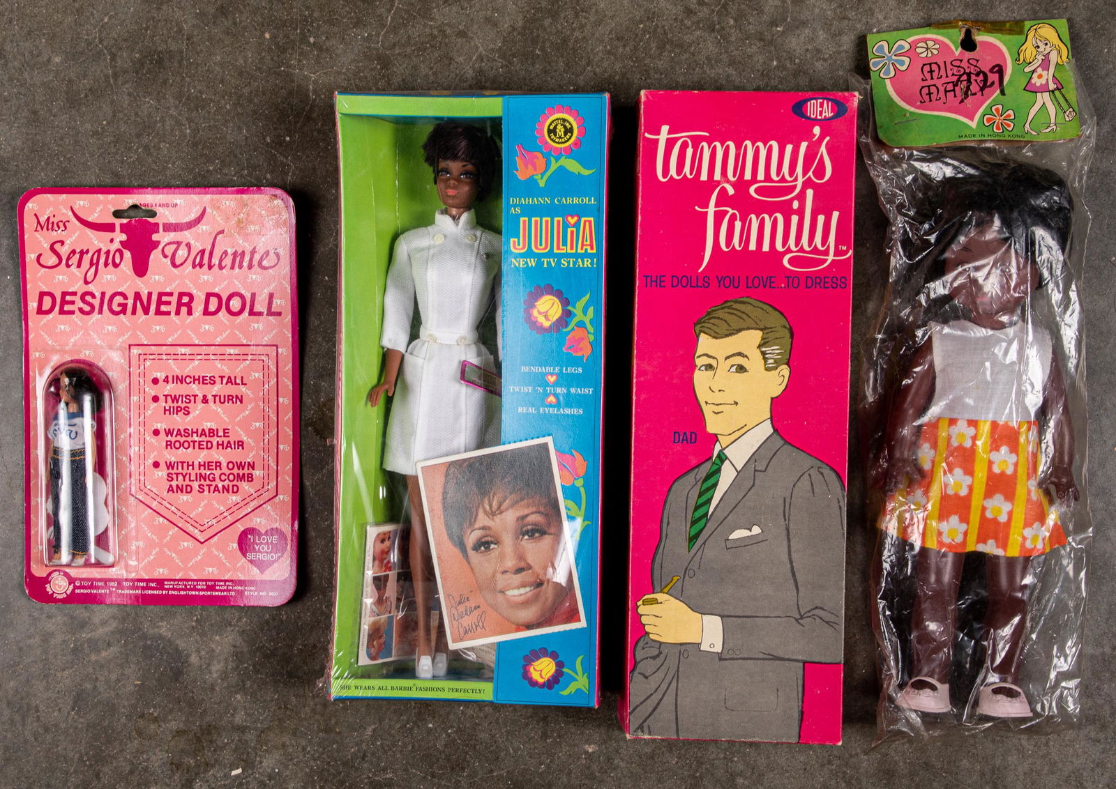 Four dolls: Four dolls, in the original boxes, to include Mattel 1968 Diahann Carroll as Julia, Ideal 1963 Tammy's Family dad, Miss Mary in plastic wrap, and 1982 Toy Time Miss Sergio Valente on original card.