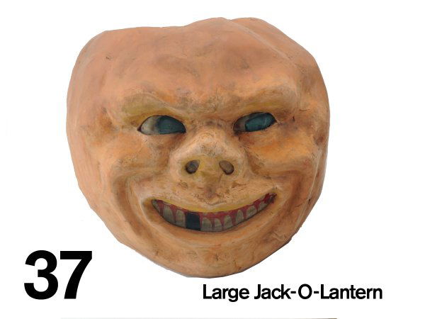 Large Jack-O-Lantern: molded paper mache, painted muslin facial inserts; imposing size with fierce expression 11" t.