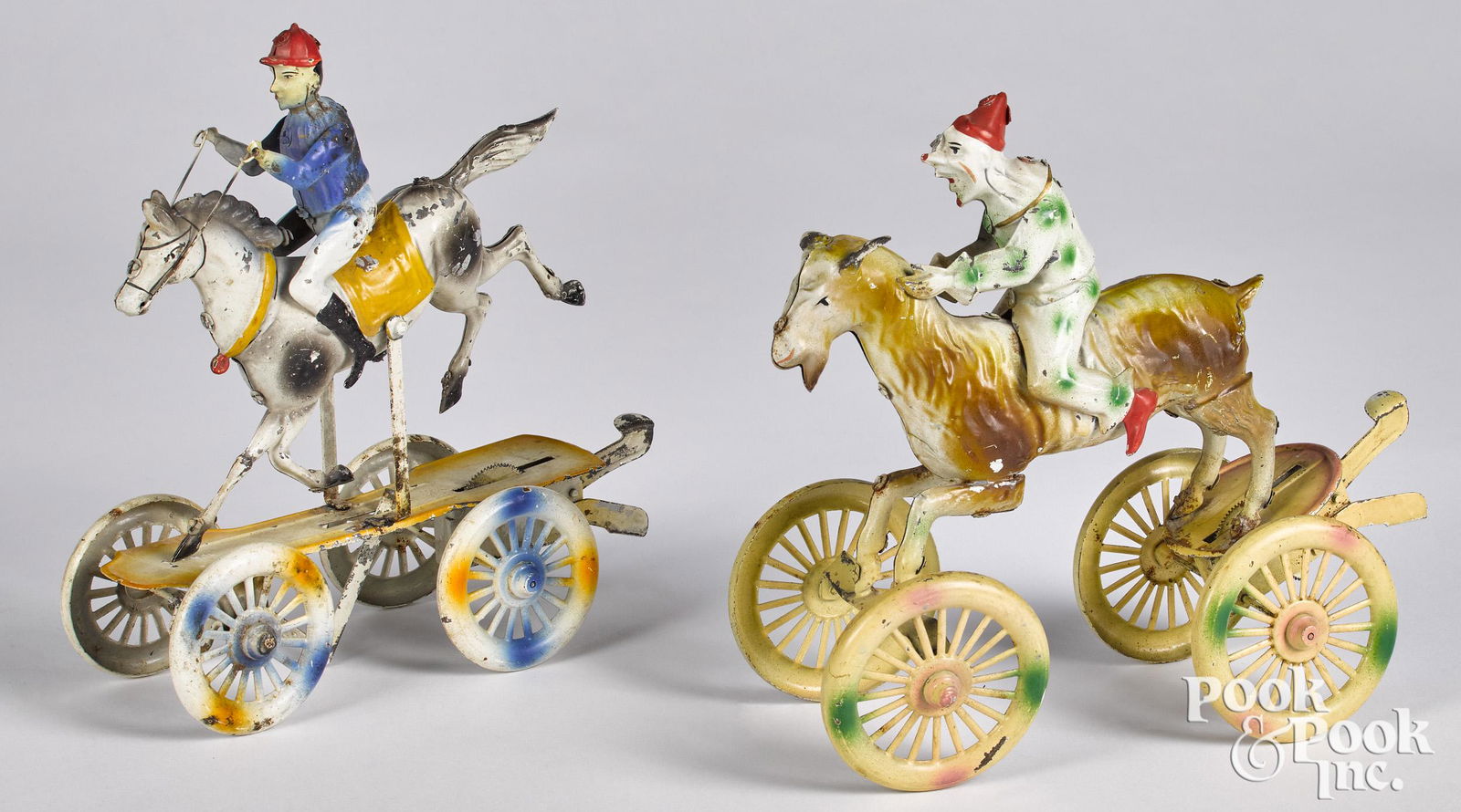 German painted tin horse and rider platform toys (1 of 2)