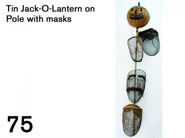 Tin Jack-O-Lantern on Pole with masks: painted tin lantern on original pole with wood finial, rear half turns into face half for candle insertion, has original candle holder, pole decorated with 3 painted wire mesh face masks including Chi