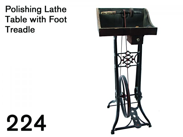 Polishing Lathe Table with Foot Treadle: decorative cast iron base with wood work table and drawer, openwork foot treadle decorated with open diamonds and six pointed star, offered with an array of honing stones, brushes, etc. - all well use