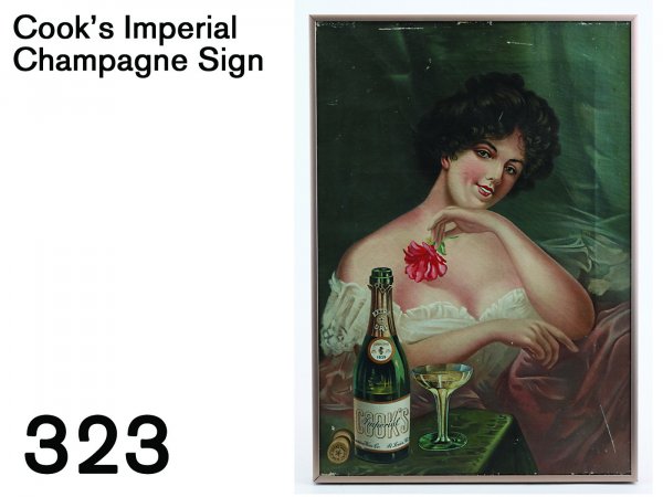Cook's Imperial Champagne Sign: colorful lithographed canvas sign on wooden stretcher in modern frame, nice image of buxom lass sitting beside an inviting glass of bubbly 14" x 20"