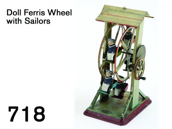 Doll Ferris Wheel with Sailors: Doll Ferris Wheel with Sailors painted tin 5 seat wheel with painted composition rides - all in sailor suits, geared drive wheel has knob for hand operation but is grooved for use as a steam engine ac