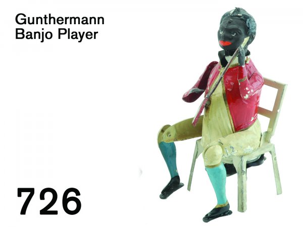 Gunthermann Banjo Player: Gunthermann Banjo Player painted tin clockwork with "plink plunk" music, great action: figure strums and taps both feet independently 6.75" t.