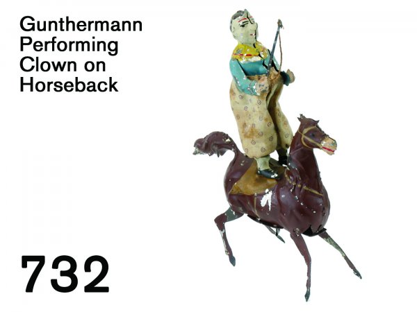 Gunthermann Performing Clown on Horseback: Gunthermann Performing Clown on Horseback painted tin with clockwork, partially cloth dressed figure stands on galloping horse, retains nice paint 7" l.