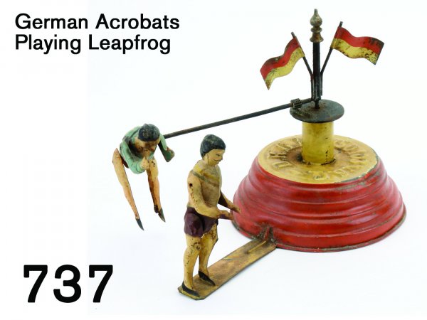 German Acrobats Playing Leapfrog: German Acrobats Playing Leapfrog painted tin with clockwork mechanism, great action toy - the runner pitches forward as the stationary figure bends over, flag bedecked base has raised legend "D.R.G.M.