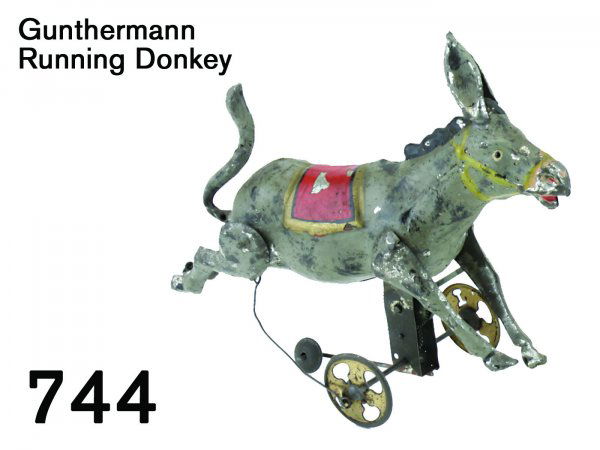 Gunthermann Running Donkey: Gunthermann Running Donkey painted tin with clockwork, great color and amusing action: donkey races forward while kicking his rear legs 7" l.