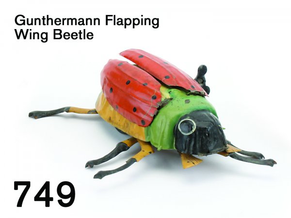 Gunthermann Flapping Wing Beetle: Gunthermann Flapping Wing Beetle very colorful painted tin with clockwork mechanism, action includes 6 moving legs and 2 large flapping wings, 8" l.