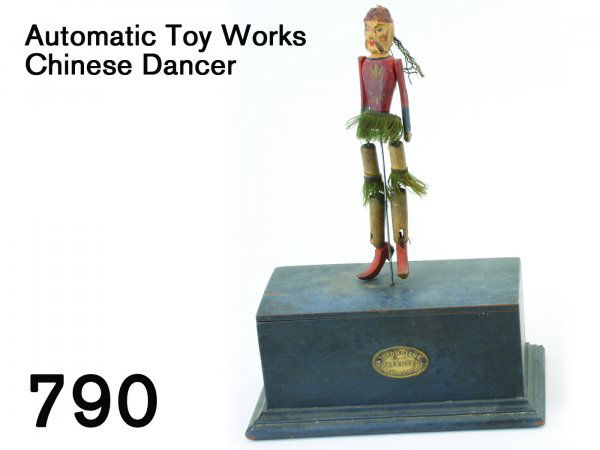 Automatic Toy Works Chinese Dancer: Automatic Toy Works Chinese Dancer wood and wire figure mounted on painted wood box housing robust clockwork mechanism, embossed copper label on box "Automatons Patented Sept. 23, 1873", interior pape