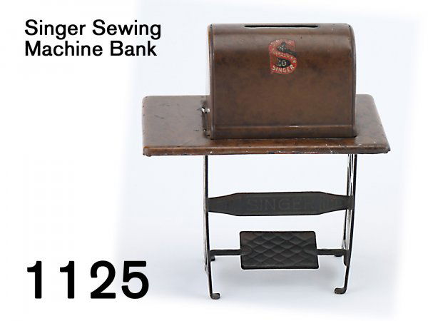 Singer Sewing Machine Bank: Singer Sewing Machine Bank lithographed tin on steel base, great detail, retains original decals 5" t.