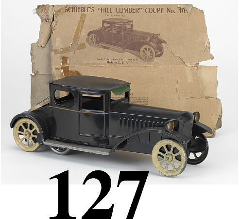 Schieble Hill Climber Coupe with box: Schieble Hill Climber Coupe with box painted tin with inertia drive motion, with original box (flattened, missing flaps, some damage and tape repairs) 17" l. excellent (some flaking on running boards