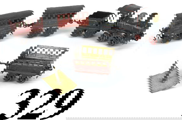 Marklin O Gauge Passenger Set with Exploding Car: Marklin O Gauge Passenger Set with Exploding Car hand enameled European outline 0-2-2 clockwork engine, 4 wheel tender and 3 passenger cars 1 of which "explodes" e & t 8" l., cars 4" l. very good to e