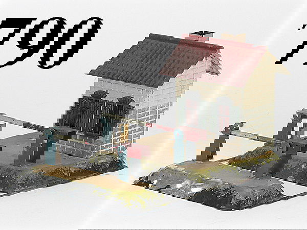 Carette Barrier Crossing with Hut: Carette Barrier Crossing with Hut painted tin with embossed painted candlelit hut, 2 moveable gates base 8" x 6.5" good (paint flaking to base, missing signal) base 8" x 6.5"