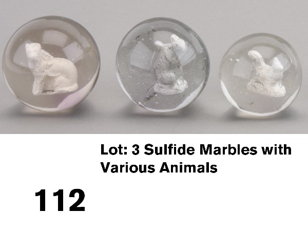 Lot: 3 Sulfide Marbles with Various Animals: circa 1880-90, German handmade clear glass marbles with kaolin animals-1 3/4" marble with cat (large bubbles at top of shoulder and on back of cat, nice clear example), 1 3/4" marble with squirrel eat