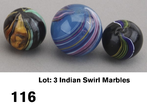 Lot: 3 Indian Swirl Marbles: circa 1880-90. German glass includes 7/8" marble of semi-opaque deep ocean blue with swirl pattern in mixed pinks, blues and white, two pontils appear to be melted over, a rare marble with minimal sur