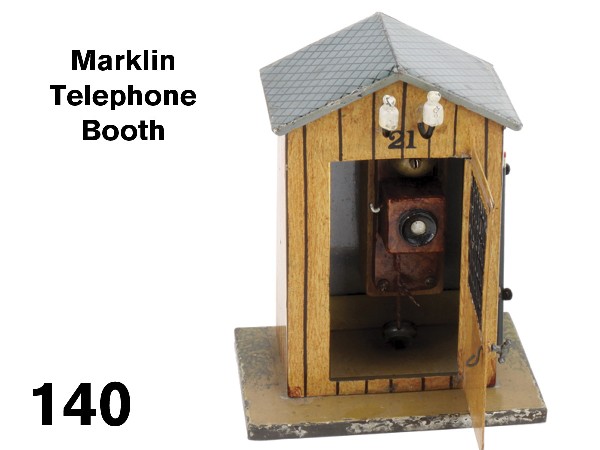 Marklin Telephone Booth: hand enameled with faux wood grain finish, larger scale accessory marked 21 over opening grate door with telephone in interior; red maker's stamp on underside Size: 4" w. x 5" t.