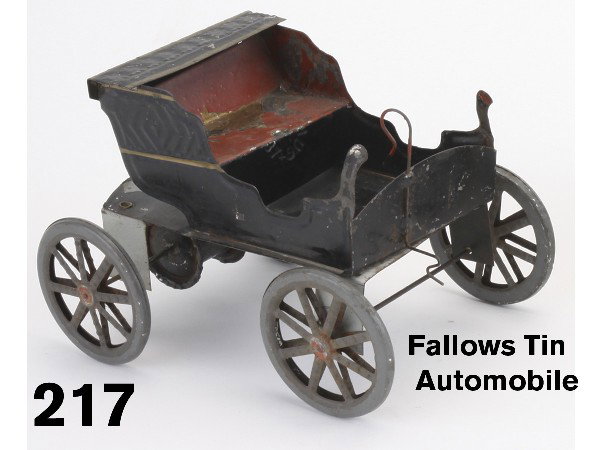 Fallows Tin Automobile: a very early American tin automobile by Fallows, retains paper label on bottom with indicating "Pat Aug. 16th '87", spool on base with string pull for friction style drive, red paint on seat is flakin