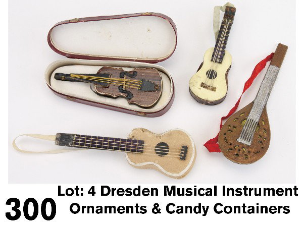 Lot: 4 Dresden Musical Instrument Ornaments & Cand: German, circa 1880-1910, embossed and pressed cardboard grouping includes violin in case, mandolin with beautiful cutout details and 2 candy container guitars (1 slide sealed shut) Size: larger 3.25" 