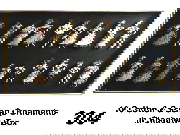 18 Cotton & Scrap Ornaments in Shadow Box: circa 1900-10, cotton batting, crepe and scrap ornaments mounted in framed shadow box; grouping includes children, a sailor, ladies, gentlemen, cooks and others Size: 36.25" l. x 18" t. x 2.25" d.