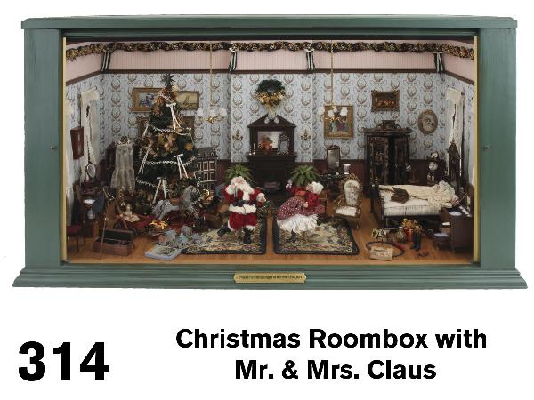 Christmas Roombox with Mr. & Mrs. Claus: painted wood box with removable glass front features The Clauses drinking and dancing around a well appointed room with 2 dressed windows on either side; one side of the room is appointed with a black
