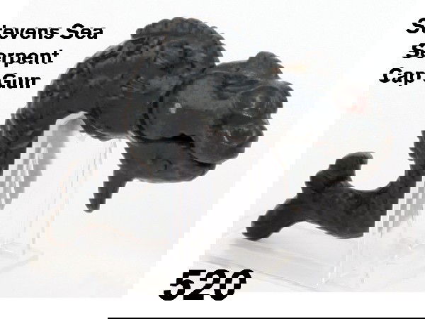 Stevens Sea Serpent Cap Gun: a beautifully cast figural cap gun in japanned iron by J. & E. Sevens, Cromwell Conn., circa 1890, an above average example retaining nice finish and some red paint in eyes Size: 4.25" l.