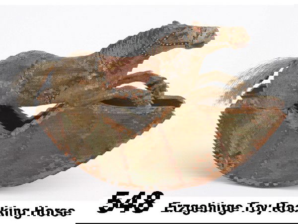 Erzgebirge Toy Rocking Horse: realistically carved and flamboyantly painted wood horse on rockers with squirrel tail, harness and rockers in black with white dots, similar pieces are found in one of the German toy sample books in