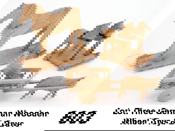 Lot: Three German Wooden Wheel Toys & Dove: unpainted carved wood, includes large horse on platform, 2 horses on platform and a pig pulling a cart with a dove onboard Size: larger platform 9.5" l.