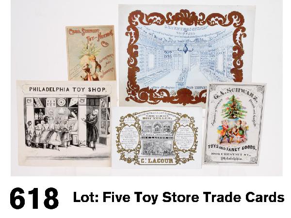 Lot: Five Toy Store Trade Cards: grouping includes engraving titled "Philadelphia Toy Shop", probably late 19th century, trade card for Lacour general store written in French, a Belgian trade card for J. B. Peeters Chopin Coiffeur, c