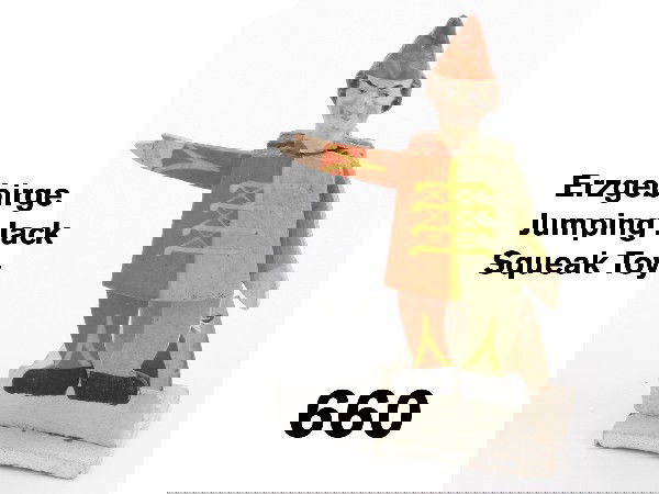 Erzgebirge Jumping Jack Squeak Toy: wooden flat cut jumping jack with hinged arms and legs and molded papier mache head,he hangs from wooden post which attaches to flat wooden base on which is a paper and wood bellows that activates fig