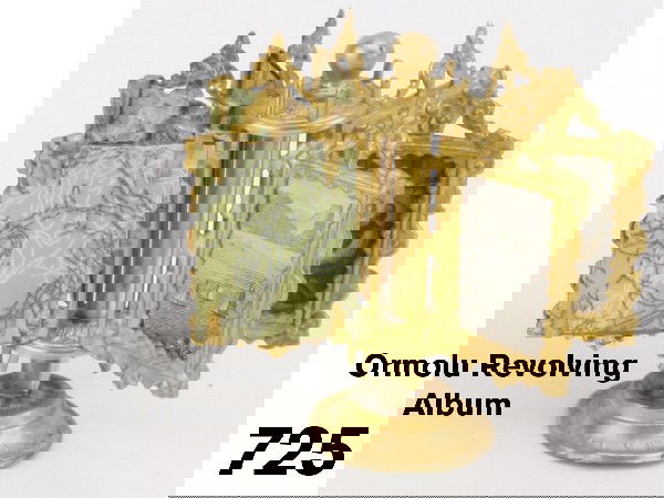 Ormolu Revolving Album: elaborate miniature accessory by Erhard & Sohne; 6 individual framed pictures pivot on bars attached to center stand Size: 2.25" t.