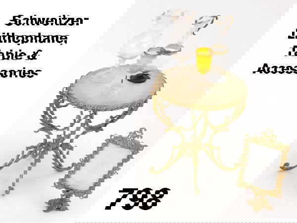 Schweitzer Lithophane, Table & Accessories: scarce gilded soft metal lithophane with attached candle holder for illumination, polished stone table with chain draping and glass carafes and goblet Size: table 2.75" t.