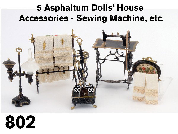 5 Asphaltum Dolls' House Accessories - Sewing Mach: gilt highlighted soft metal grouping includes student lamp, sewing machine, fireplace tools in stand, blanket stand and wall hanging towel rack with needlepoint backing Size: lamp 3" t.