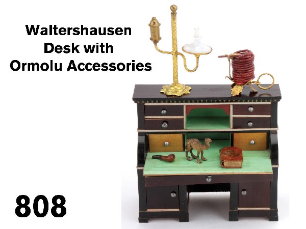 Waltershausen Desk with Ormolu Accessories: faux rosewood toned curved fall front desk with 6 drawers, 1 long drawer and 2 doors, ormolu student's lamp and wax jack, small wood pipe, miniature book (non opening)and painted metal camel Size: des