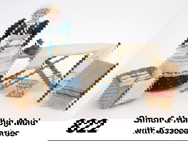 Simon & Halbig Maid with Accessories: painted bisque doll outfitted as laundress (nicely redressed) holding a neatly folded stack of fresh linens offered with painted cast metal ironing board (repainted), iron, miniature block of Magic Bl