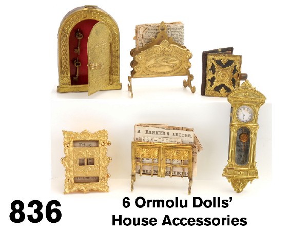 6 Ormolu Dolls' House Accessories: hanging wall clock with glass front, key cabinet with 4 hooks and 4 tiny keys, photo album, 2 magazine racks and a scarce calendar with 4 knobs that change paper scrolls for month, day and date; made
