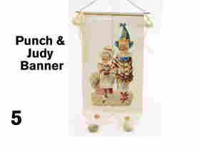Punch & Judy Banner: embossed lithographed die cut image mounted on silk banner decorated with Dresden stars, ribbons and pom poms Size: 13" l.