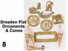 Dresden Flat Ornaments & Cones: embossed gilt and scrap ornament grouping includes 3 with religious imagery, baby in intricate hammock, 2 parrots on perches, elephant on platform, large floral frame, small gum wrapper lantern and 4