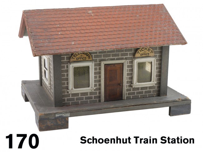 Schoenhut Train Station: painted wood and embossed heavy composition board which simulates brick and tile construction, glassine windows, retains Telegraph and Ticket office signage on both sides, partial original maker's log