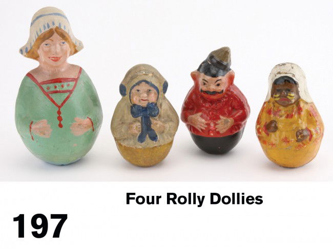 Lot: Four Rolly Dollies: hand painted papier mache figures; larger unmarked; three smaller figures are by Schoenhut, 2 of which retain original cloth maker's labels Size: larger 6.5" t., others appr. 4.25" t. ea.,