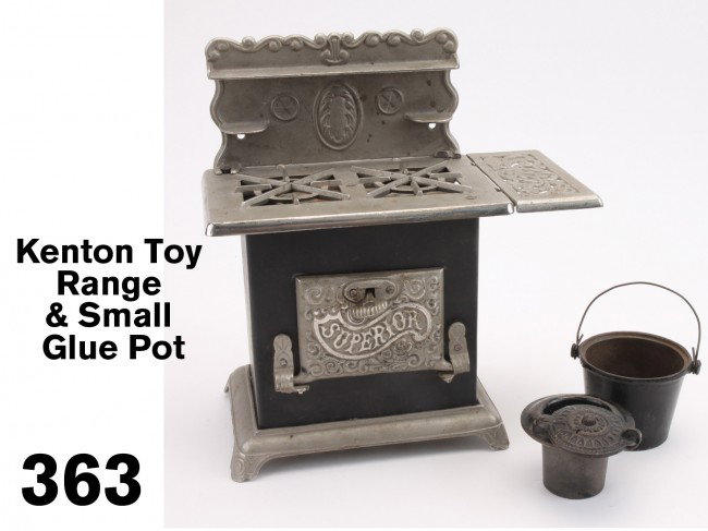 Kenton Toy Range & Small Glue Pot: nickel plated cast iron and steel two burner gas range, nozzle for actual use with gas is under removable side extension, offered along with a diminutive double wall cast iron glue pot with decorative