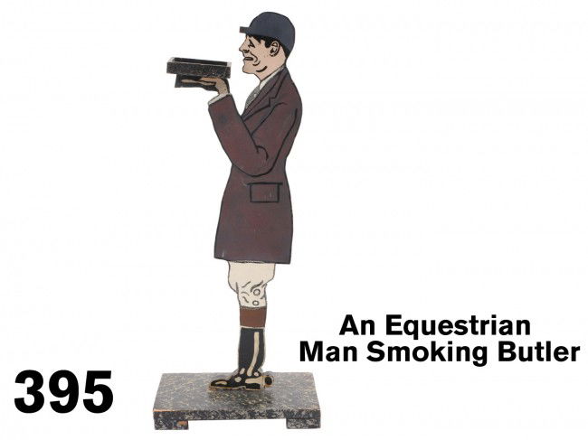 An Equestrian Man Smoking Butler: painted wood figure decorated on each side, unusual form for a butler: man is outfitted in jodhpurs, riding boots and cap Size: 29.5" t.