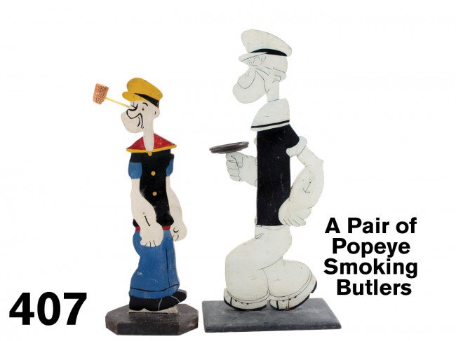 A Pair of Popeye Smoking Butlers: painted wood figures decorated on each side, Popeye first appeared in 1929 and has been with us ever since with his imagery changing from Elzie Segar's first renditions as other artists took over afte