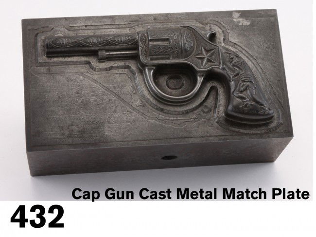 Cap Gun Cast Metal Match Plate: a very heavy cast metal match plate used for casting cap guns, amazing detail with neat image of a cowboy with drawn gun - also amazing weight - this piece weighs in at 35 pounds - makes a great door