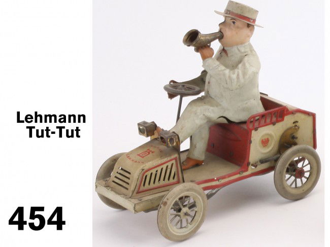 Lehmann Tut-Tut: painted and lithographed tin, clockwork, with operating bellows, a nice example that could be improved with cleaning Size: 7" l.