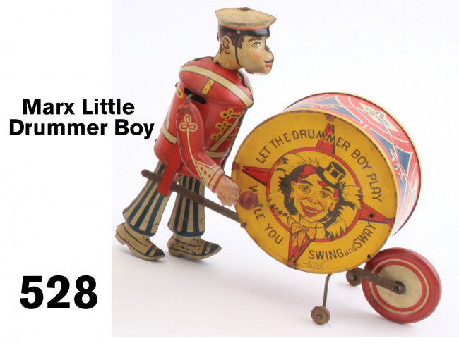 Marx Little Drummer Boy: lithographed tin, clockwork powered - he beats the drum and rolls it along Size: 8" t.