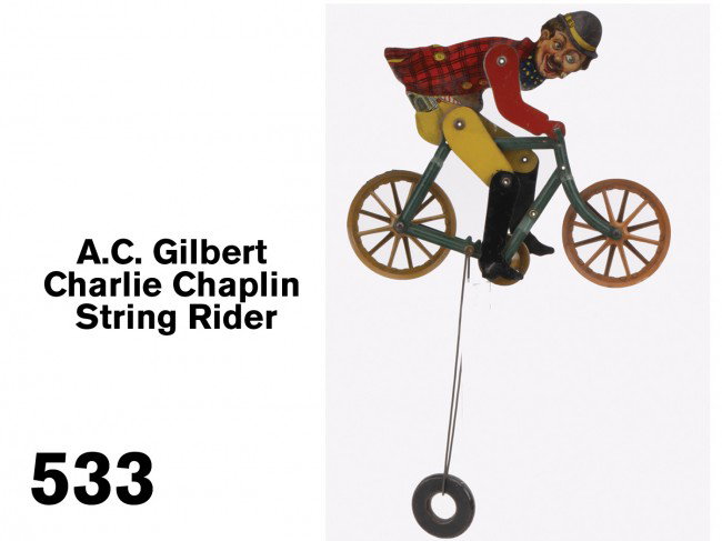 A.C. Gilbert Charlie Chaplin String Rider: articulated lithographed tin figure with counterweight, an above average example Size: 8" l.