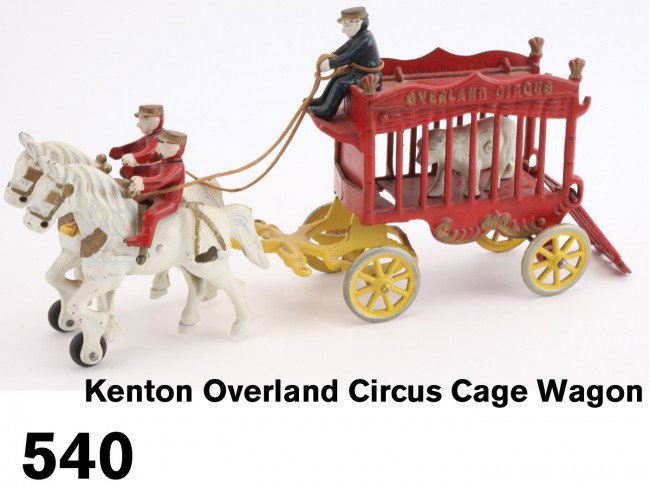 Kenton Overland Circus Cage Wagon: painted cast iron, includes polar bear, driver, 2 outriders - a truly exceptional example Size: 14.5" l.