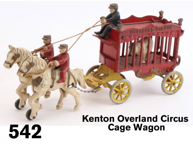 Kenton Overland Circus Cage Wagon: painted cast iron, includes polar bear, driver, 2 outriders - a very fine all original example; retains original price of "3.98" on horse's haunch Size: 14.5" l.
